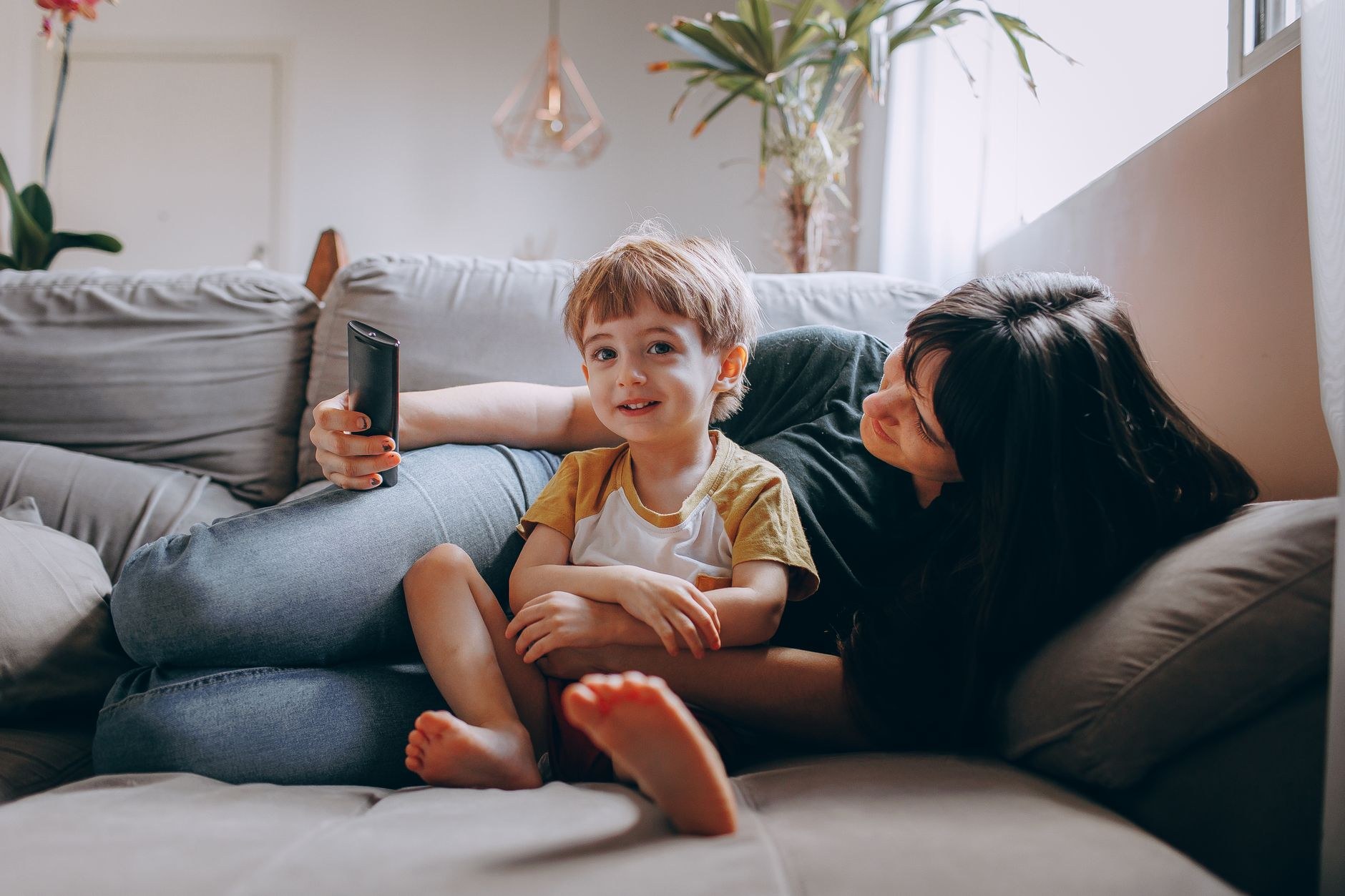 A family relaxing in a cool, comfortable Auckland living room